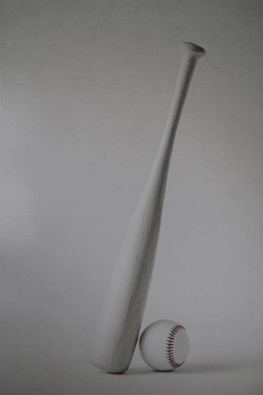 A matte white baseball bat standing upright next to a white baseball with red stitching, set against a neutral gray studio background.