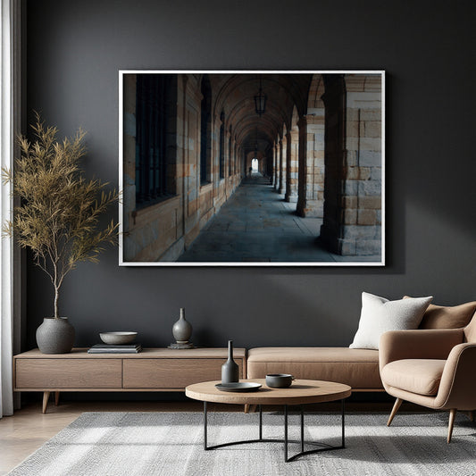 A large framed wall art print depicting a stone archway corridor, displayed in a modern living room setting above a wooden console table and sofa.