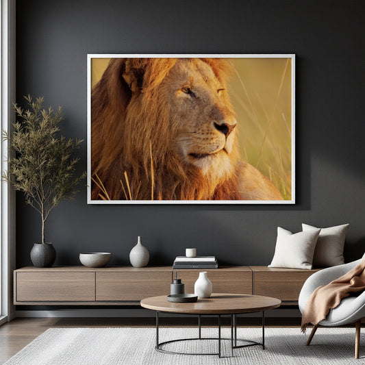 A large framed wall art print of a lion in warm golden tones, displayed above a modern wooden console in a styled living room with a chair, coffee table, and vases.