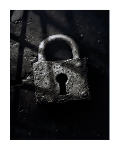 A close-up photograph of a weathered metal padlock with a textured, rusted surface, set against a dark, shadowed background.
