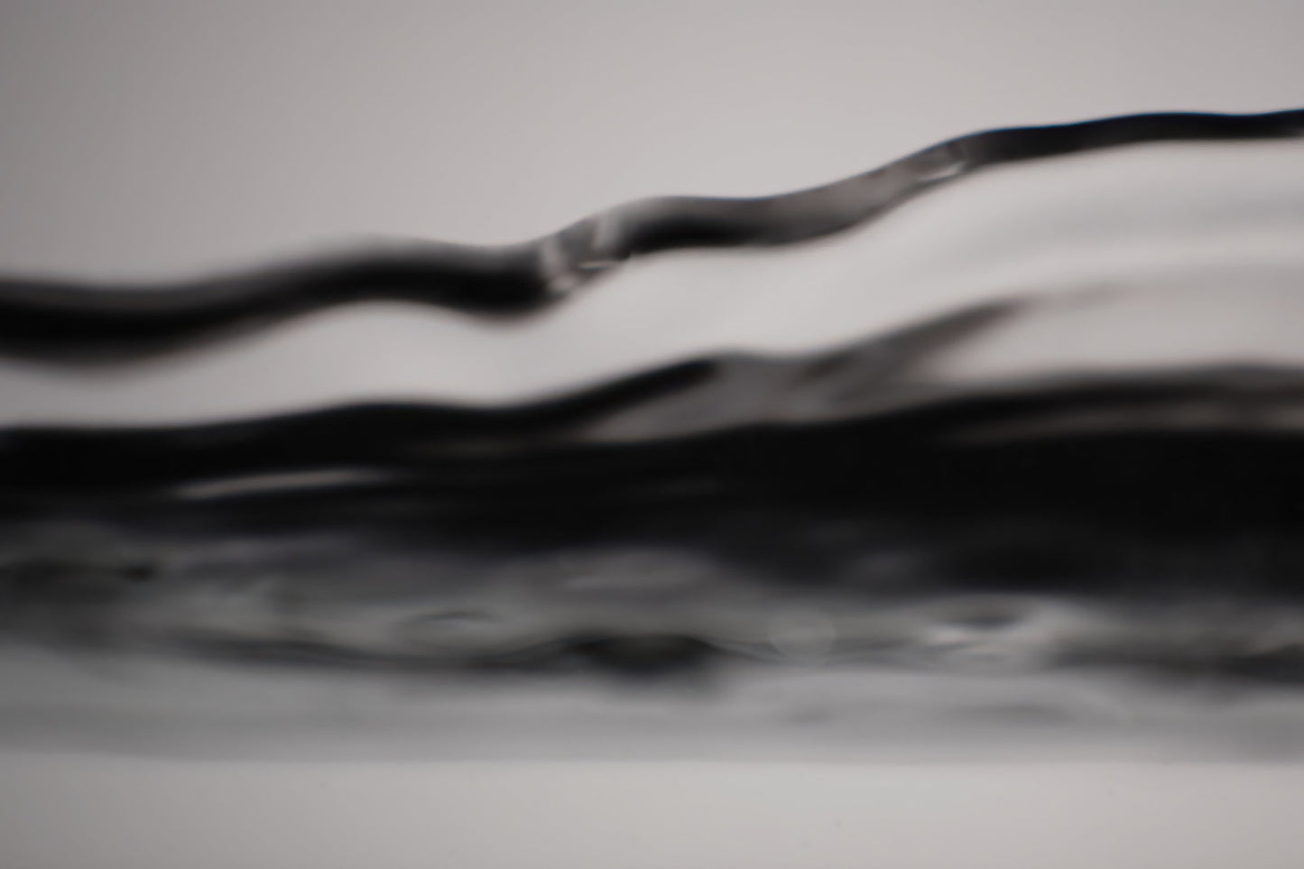 Photo of Abstract black and white wavy pattern filling the frame.