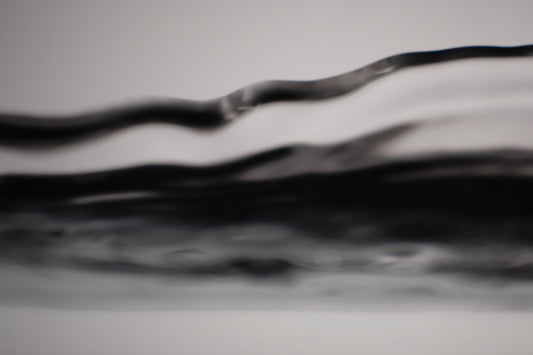 Photo of Abstract black and white wavy pattern filling the frame.