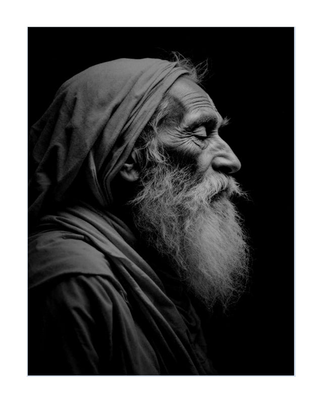 Black and white portrait print of an elderly man with a long beard and head covering, shown in profile against a dark background.
